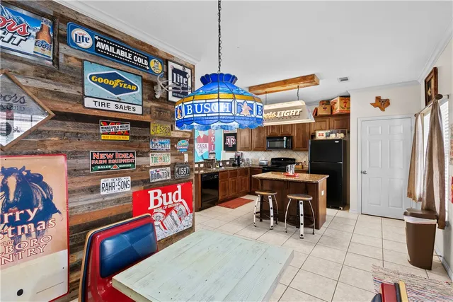 a open kitchen with stainless steel appliances granite countertop a stove and refrigerator