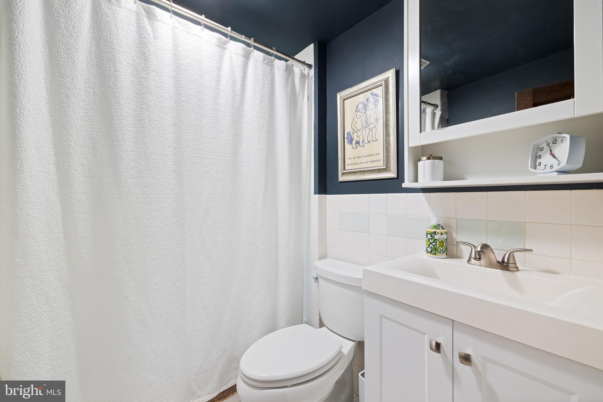 106 Manchester Road Media, PA 19063 - Photo 19 of 34 a bathroom with a sink a toilet and a window