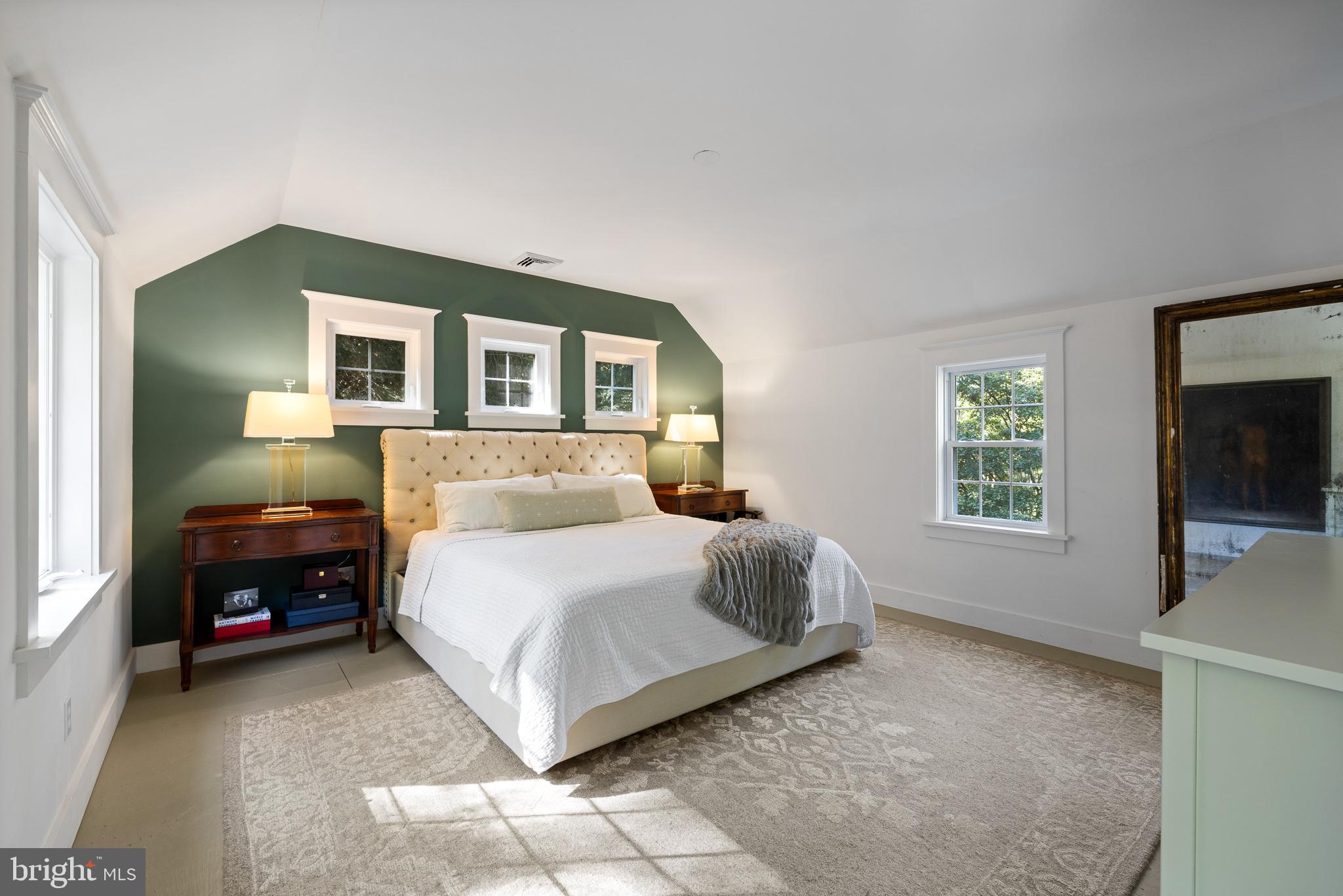 106 Manchester Road Media, PA 19063 - Photo 21 of 34 a spacious bedroom with a bed and a flat screen tv