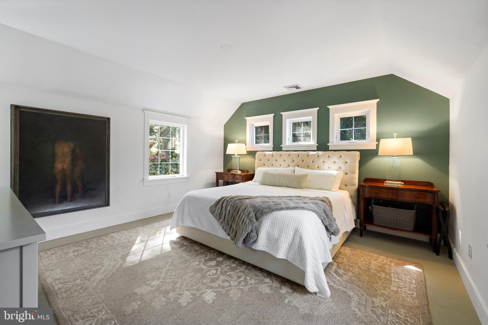 106 Manchester Road Media, PA 19063 - Photo 22 of 34 a spacious bedroom with a bed and a flat screen tv