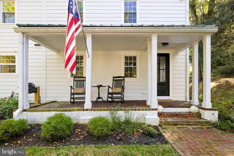a front view of a house with a small yard