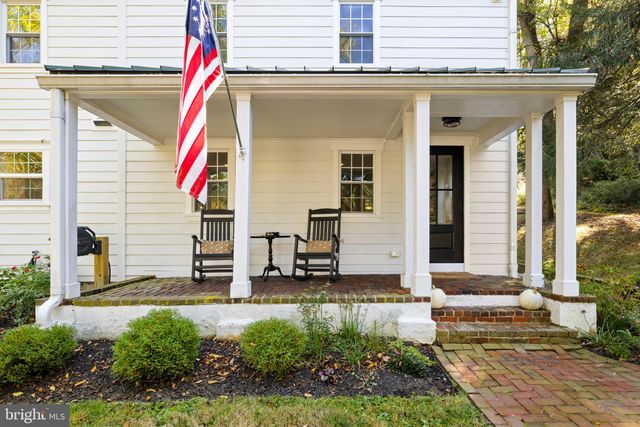 a front view of a house with a small yard