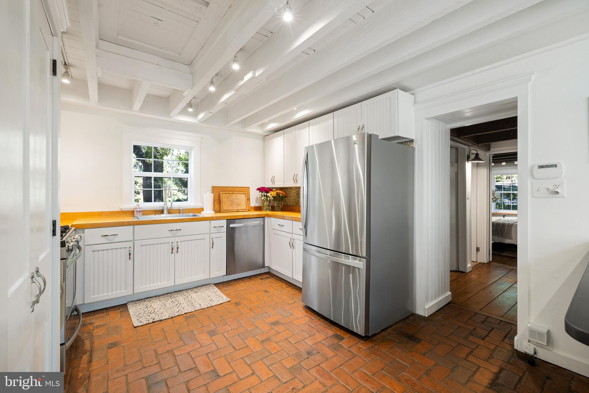 106 Manchester Road Media, PA 19063 - Photo 7 of 34 a kitchen with a refrigerator sink and cabinets