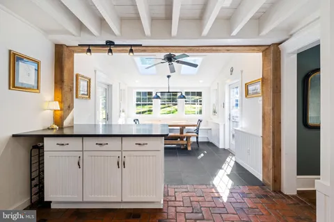 a living room with granite countertop furniture and a window