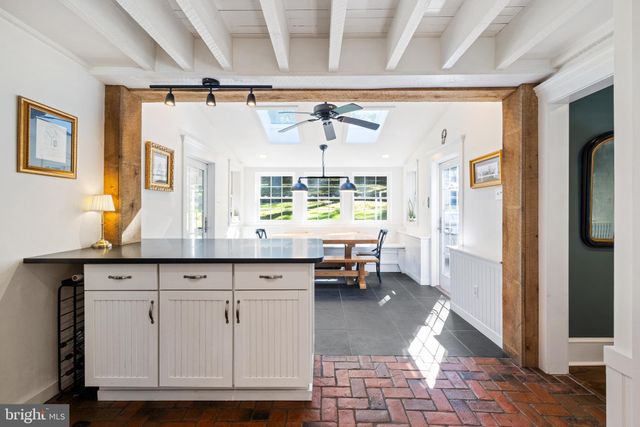 a living room with granite countertop furniture and a window