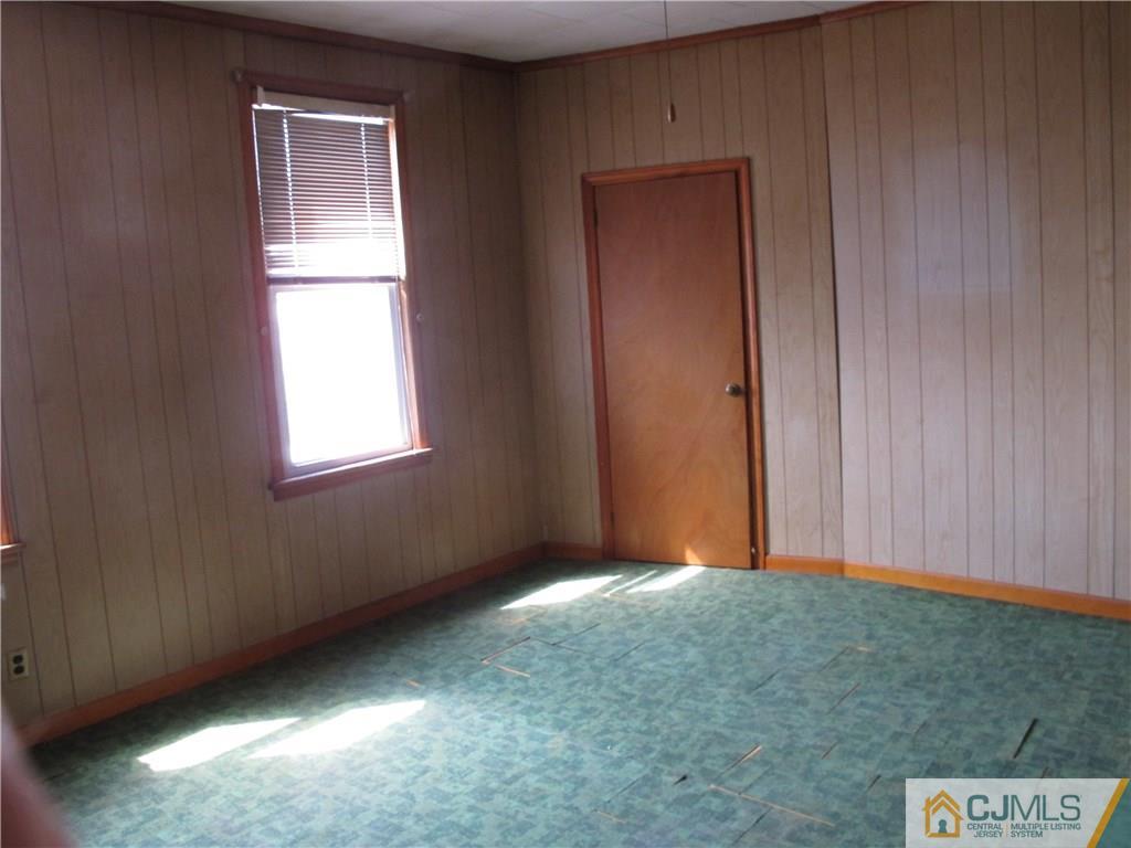350 Summit Avenue Perth Amboy, NJ 08861 - Photo 11 of 20 an empty room with windows