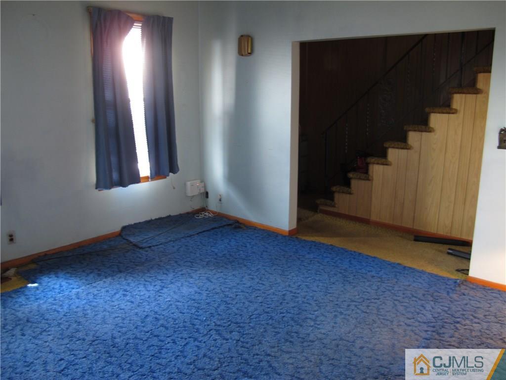 350 Summit Avenue Perth Amboy, NJ 08861 - Photo 20 of 20 an empty room with wooden floor and windows