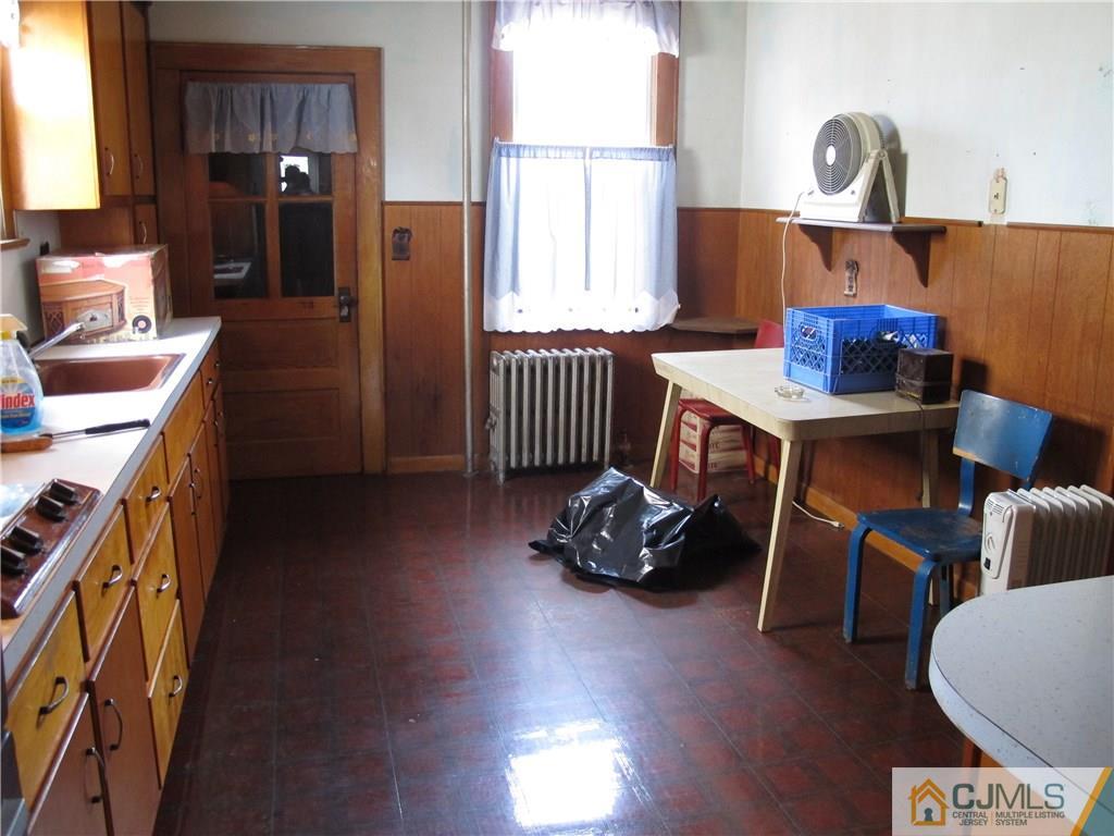 350 Summit Avenue Perth Amboy, NJ 08861 - Photo 3 of 20 a living room with furniture and a window