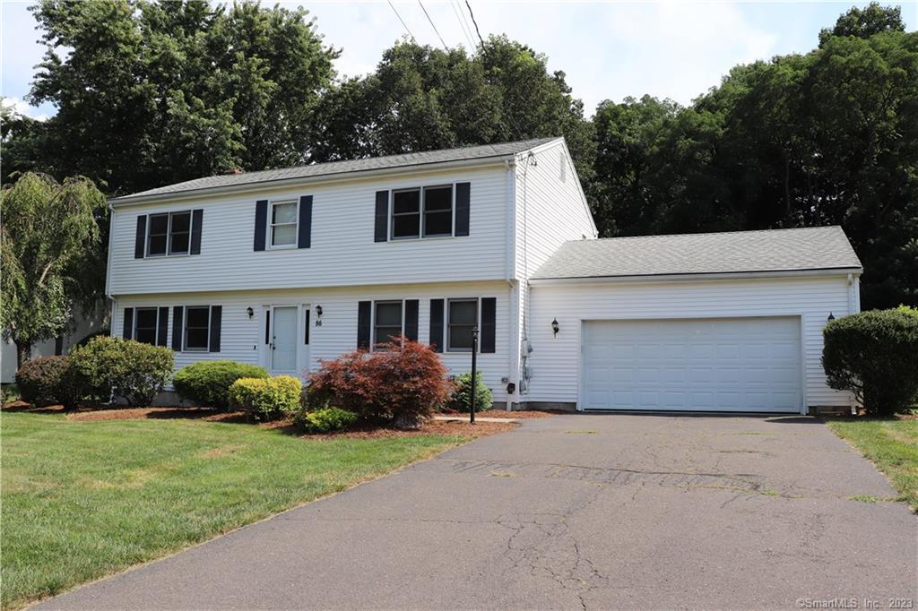 86 Garden Grove Road Manchester, CT 06040 - Photo 1 of 1 a front view of a house with garden