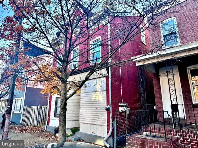a view of a house with a tree