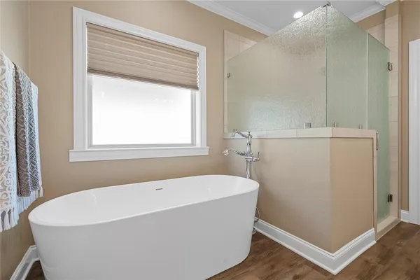 a white bath tub sitting in a bathroom