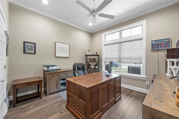 a room with furniture a flat screen tv and a fireplace