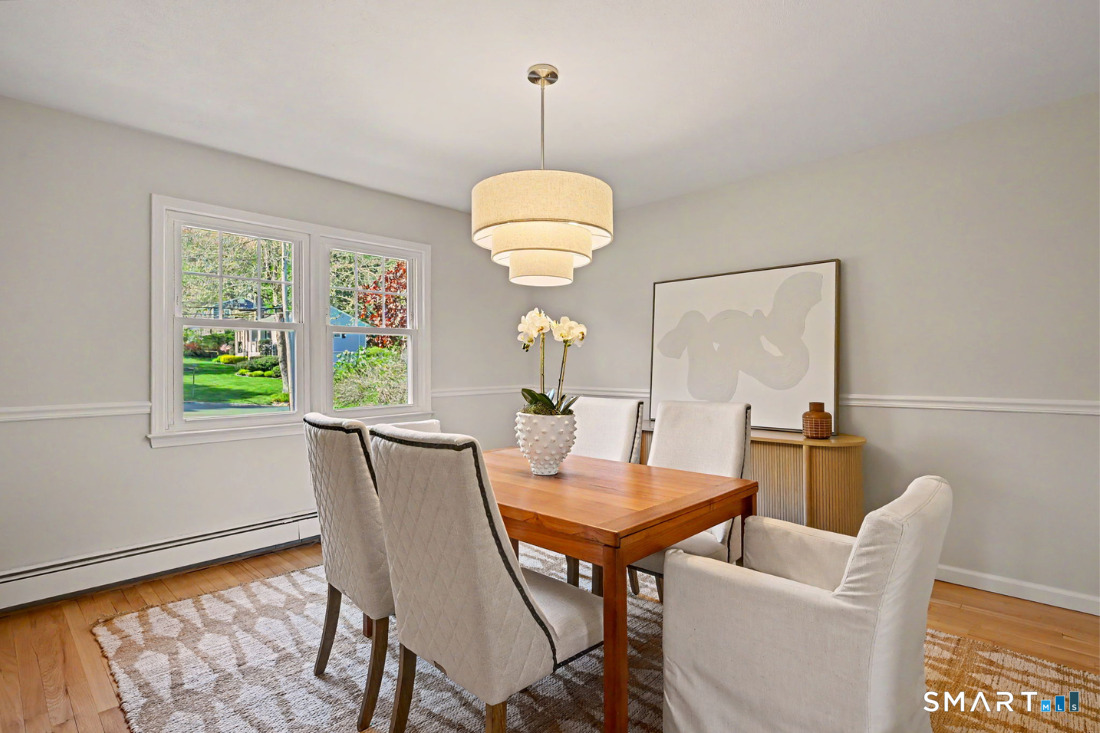 370 Nepas Road Fairfield, CT 06825 - Photo 6 of 32 a dining room with furniture and wooden floor