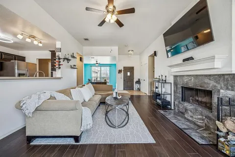 a living room with furniture and a fireplace