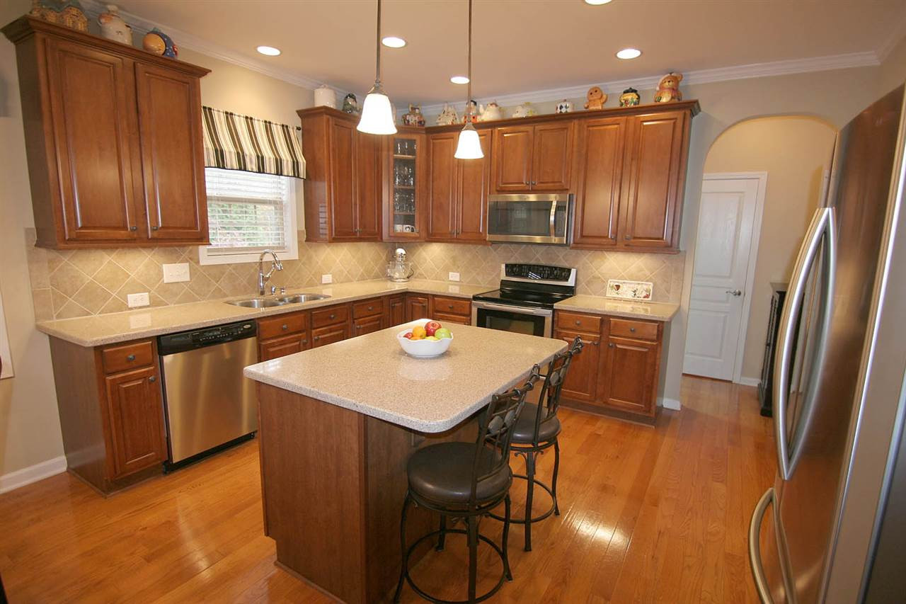 2723 Kinsley Place Raleigh, NC 27616 - Photo 12 of 25 Quartz counters/tile back splash