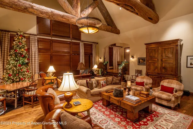 a large kitchen with a table and chairs