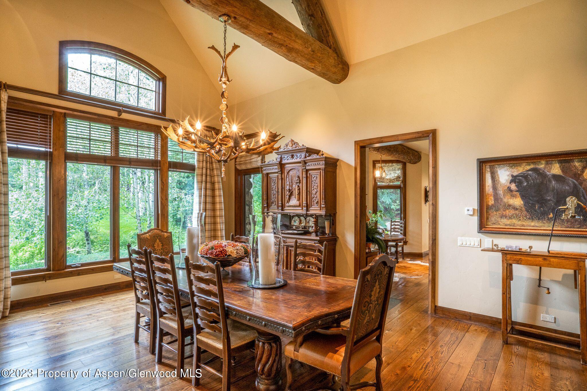 800 South Hayden Road Aspen, CO 81611 - Photo 24 of 60 a view of a dining room with furniture window and wooden floor