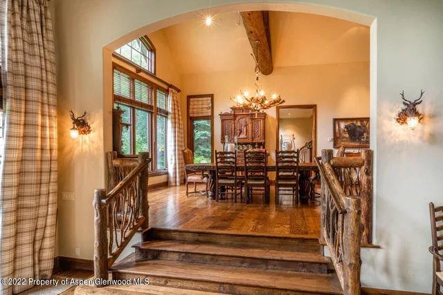 a view of a dining room with furniture window and outside view
