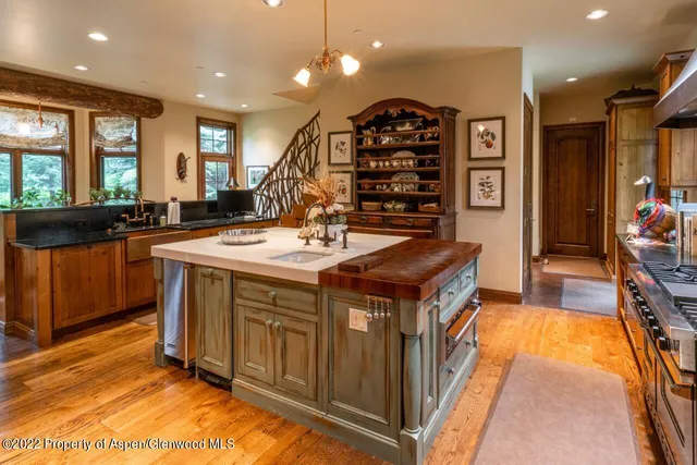 a living room with furniture and floor to ceiling windows