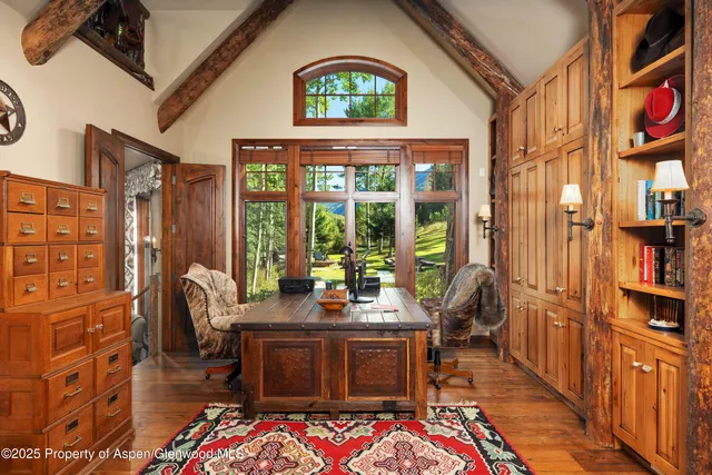 a bathroom with a granite countertop toilet sink and mirror