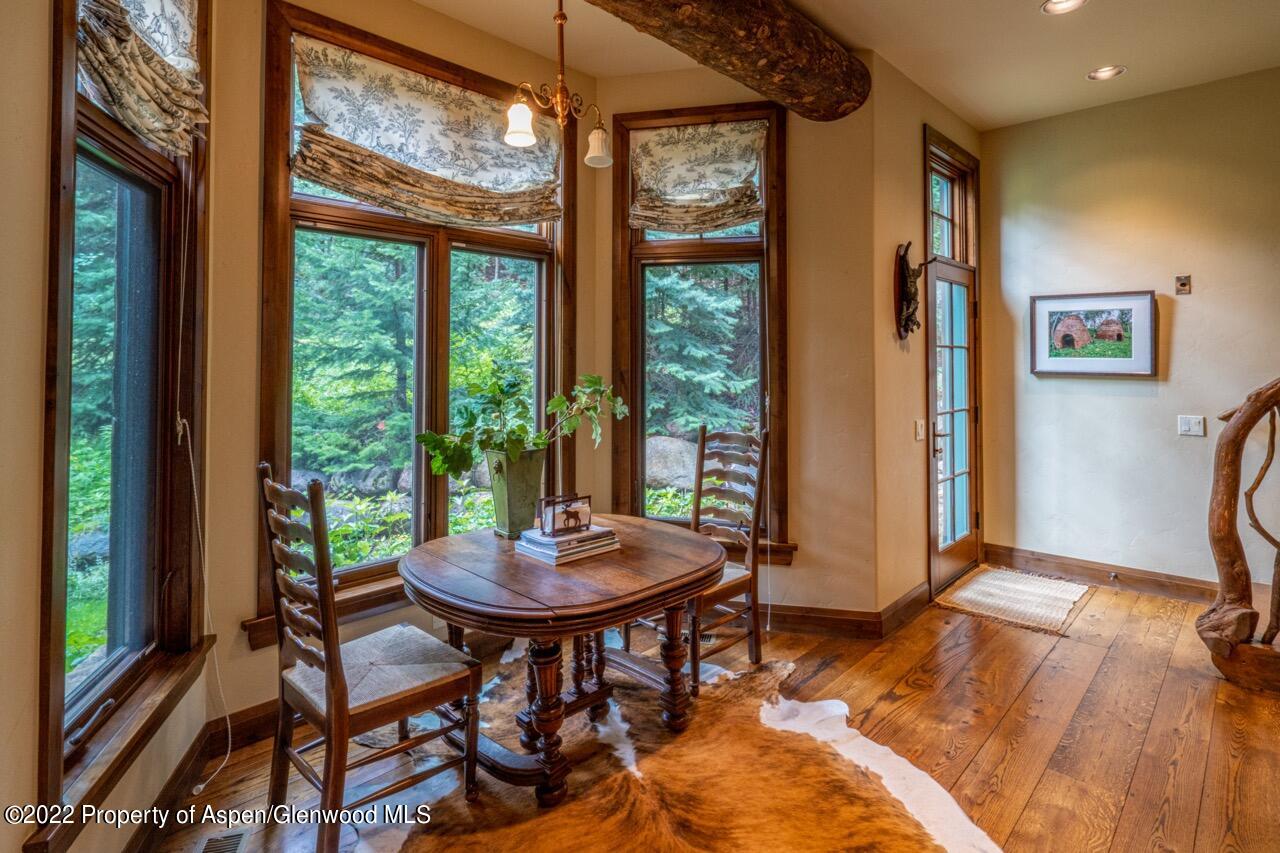800 South Hayden Road Aspen, CO 81611 - Photo 39 of 60 a view of a dining room with furniture window and outside view