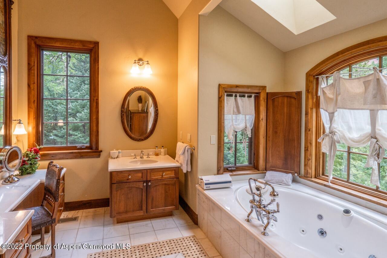 800 South Hayden Road Aspen, CO 81611 - Photo 44 of 60 a very nice looking rest room with a large window