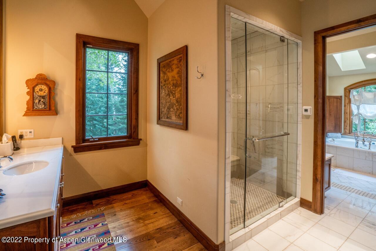 800 South Hayden Road Aspen, CO 81611 - Photo 45 of 60 a bathroom with a tub and shower