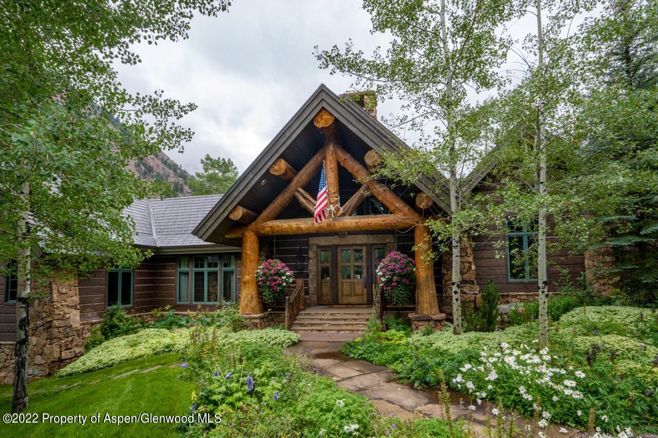 800 South Hayden Road Aspen, CO 81611 - Photo 6 of 60 a front view of a house with garden