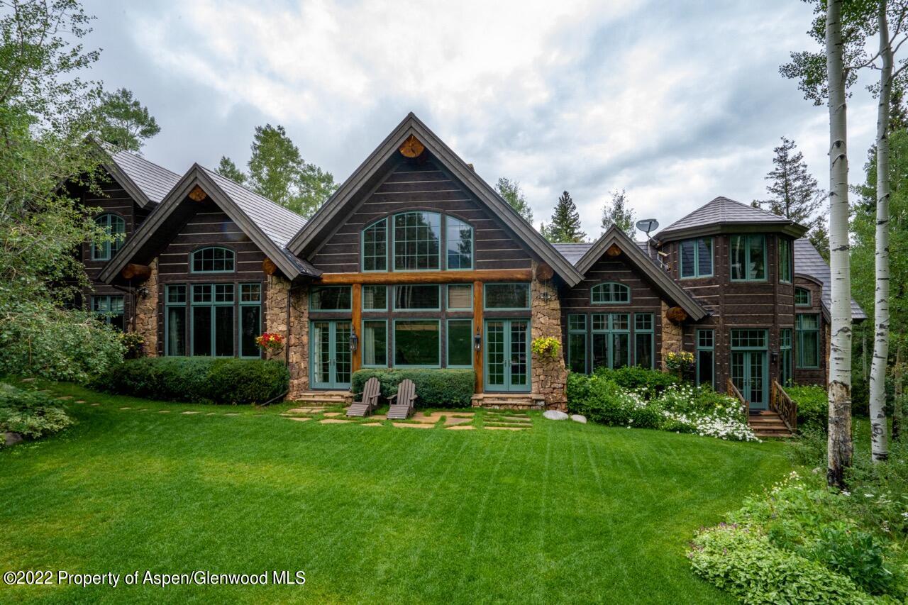 800 South Hayden Road Aspen, CO 81611 - Photo 7 of 60 a front view of a house with garden