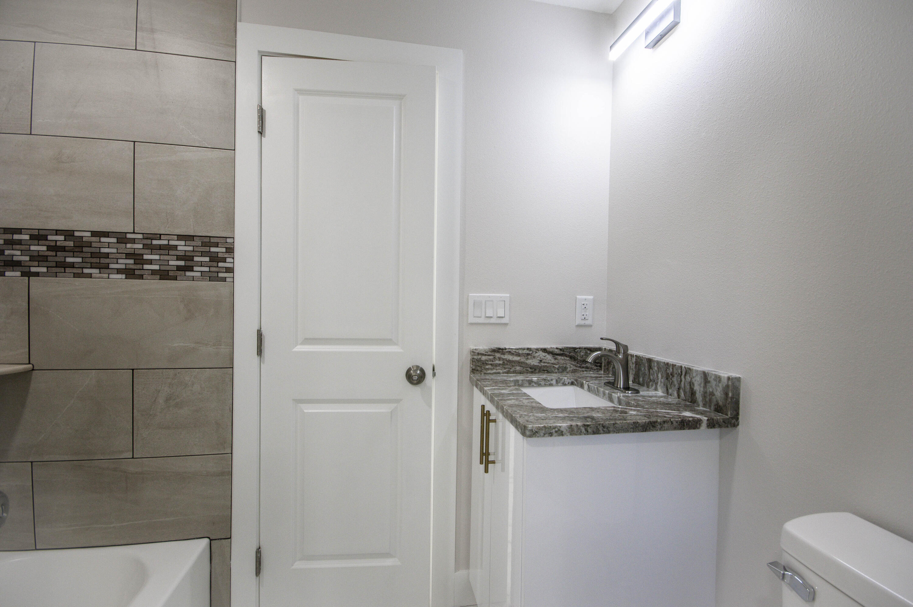 311 Southwest 67th Drive Okeechobee, FL 34974 - Photo 11 of 30 a bathroom with a sink and vanity