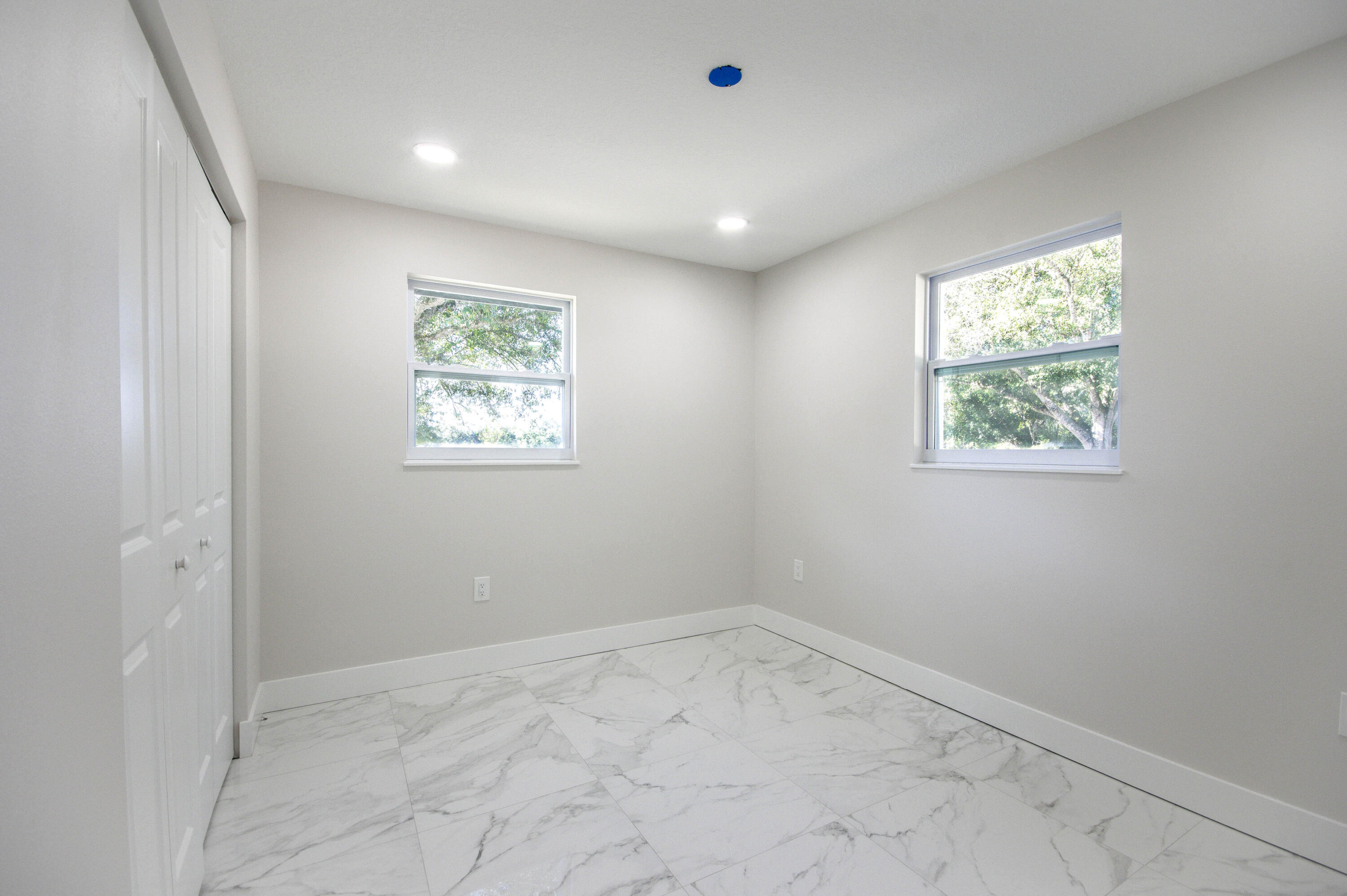 311 Southwest 67th Drive Okeechobee, FL 34974 - Photo 12 of 30 an empty room with windows