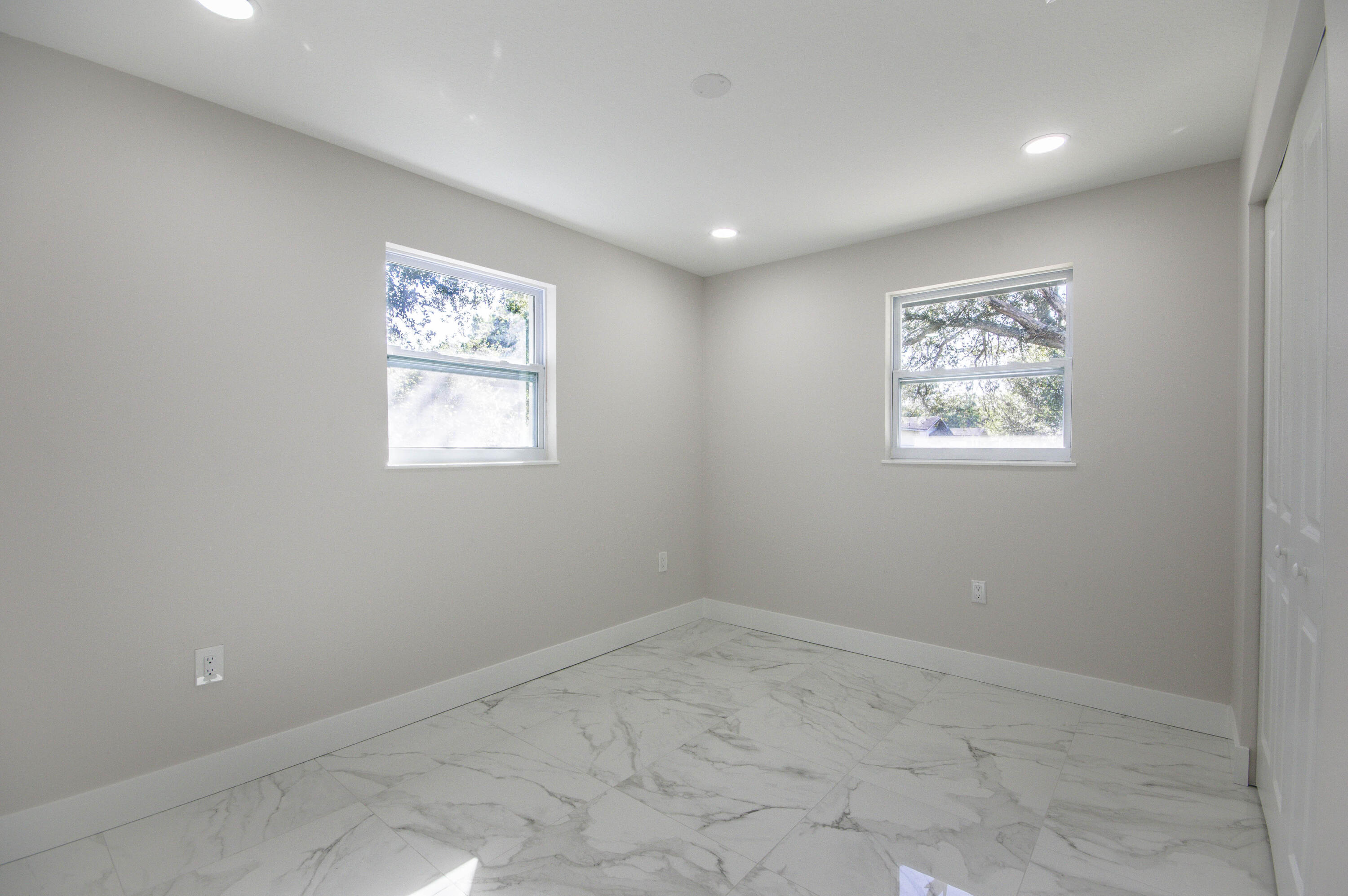 311 Southwest 67th Drive Okeechobee, FL 34974 - Photo 18 of 30 an empty room with windows