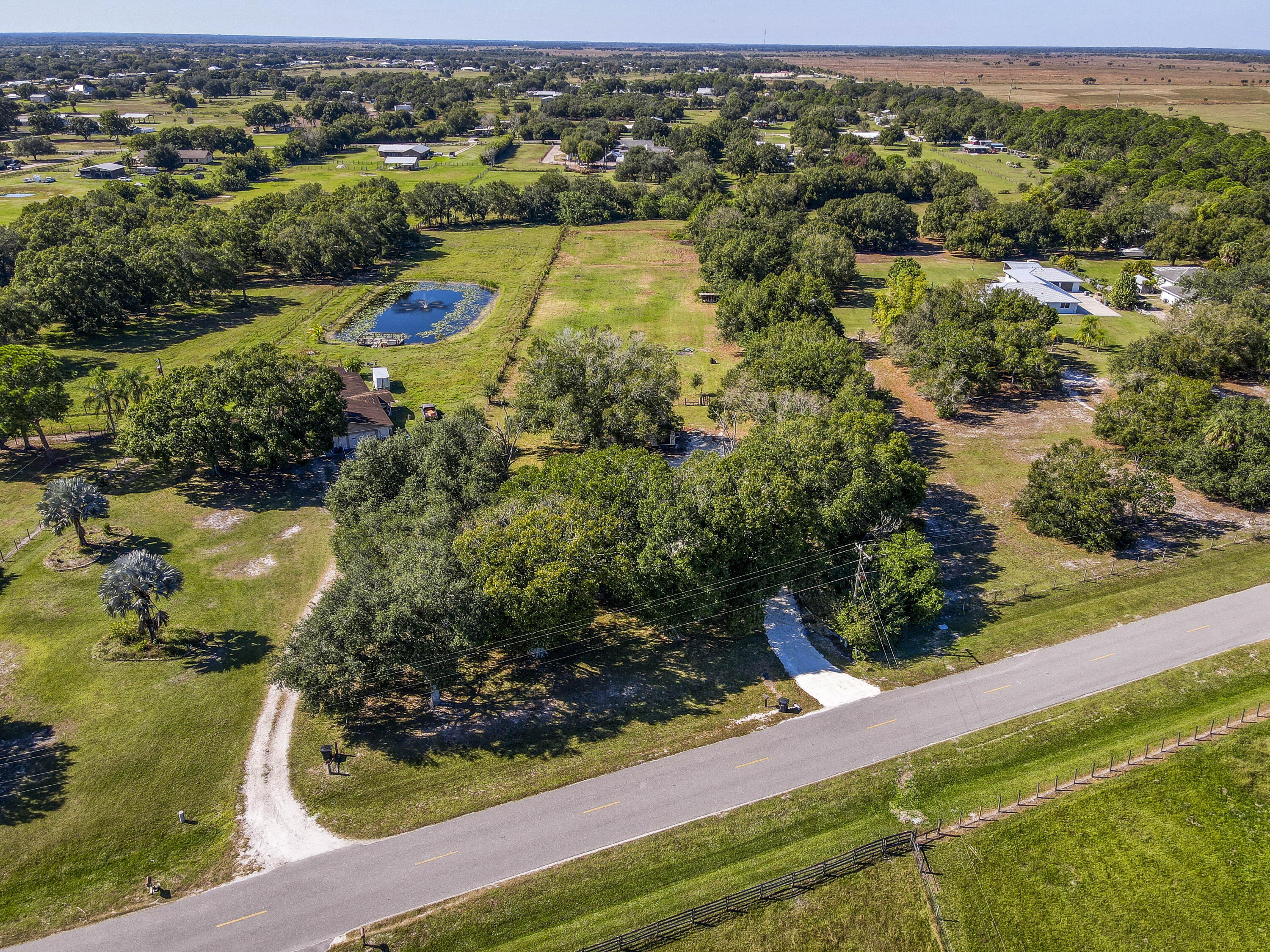 311 Southwest 67th Drive Okeechobee, FL 34974 - Photo 26 of 30 an aerial view of residential houses with outdoor space