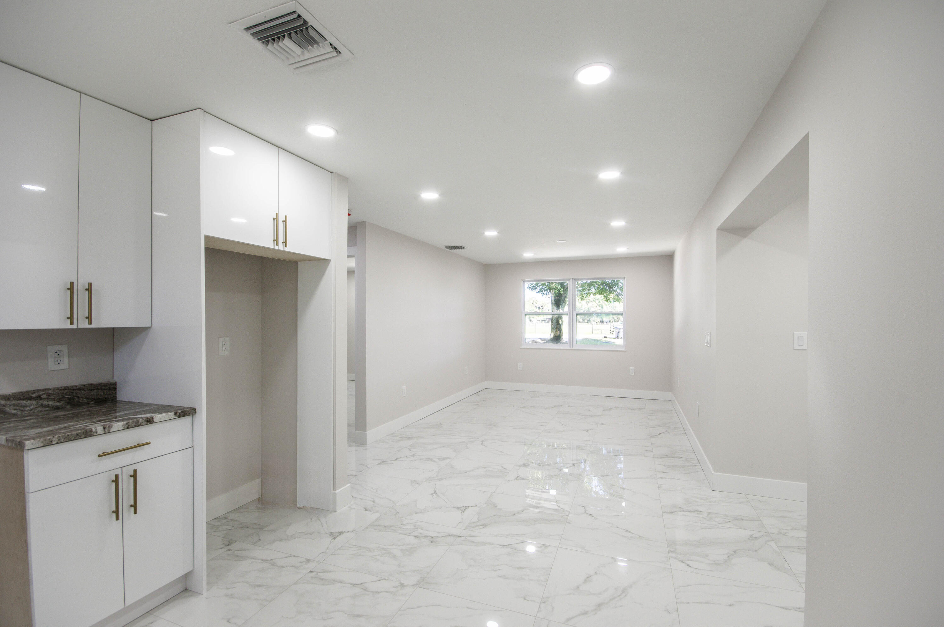 311 Southwest 67th Drive Okeechobee, FL 34974 - Photo 6 of 30 a view of an empty room and a window