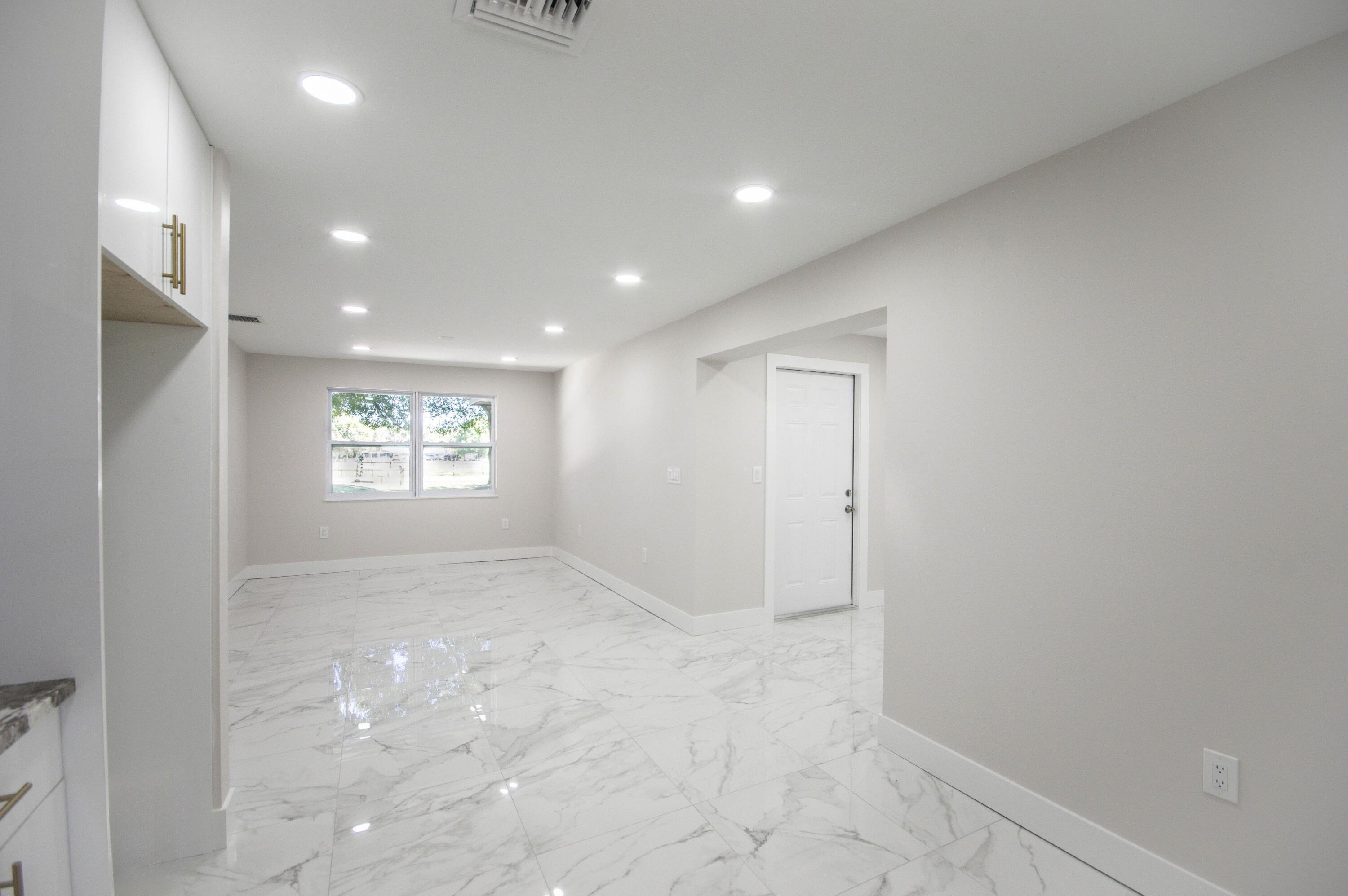 311 Southwest 67th Drive Okeechobee, FL 34974 - Photo 7 of 30 an empty room with windows and closet