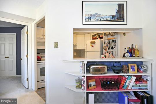1301 North Courthouse Road, Unit 1507 Arlington, VA 22201 - Photo 11 of 16 a living room with baby cabinets and baby crib