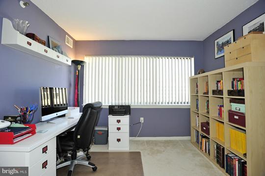 1301 North Courthouse Road, Unit 1507 Arlington, VA 22201 - Photo 4 of 16 a workspace with furniture and window