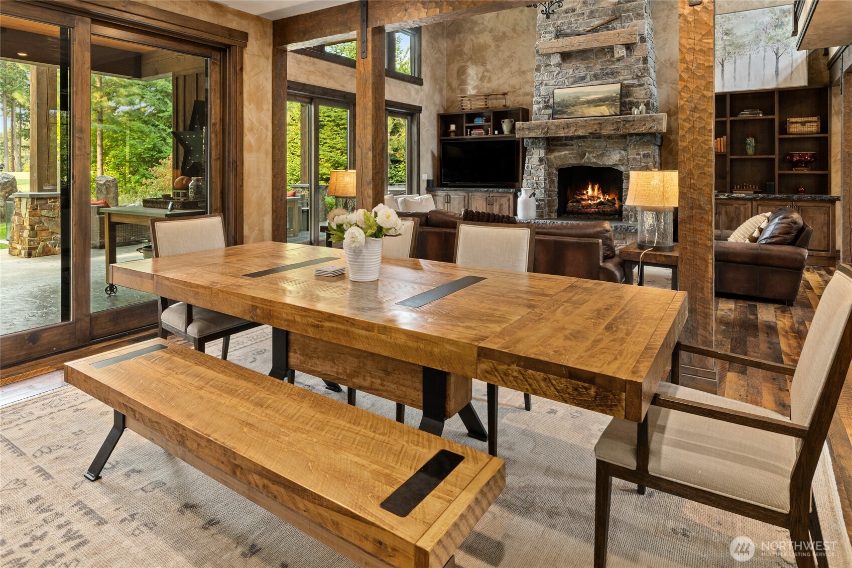 530 Spragger Way Cle Elum, WA 98922 - Photo 11 of 40 a living room with furniture a fireplace and a floor to ceiling window
