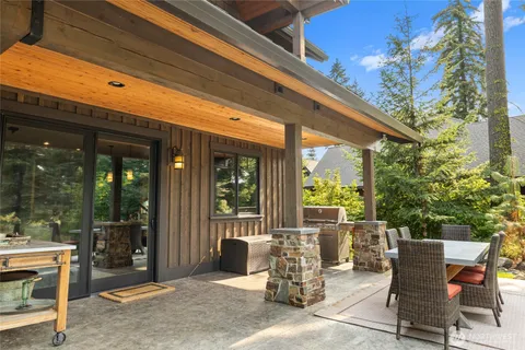 a view of a patio with table and chairs and potted plants