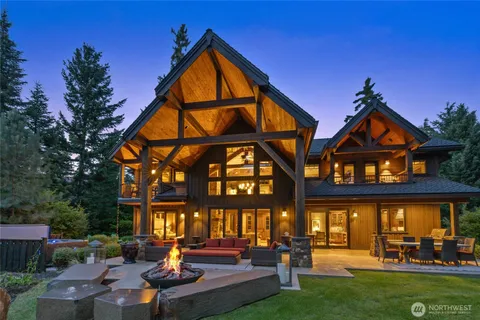 a front view of a house with swimming pool and porch