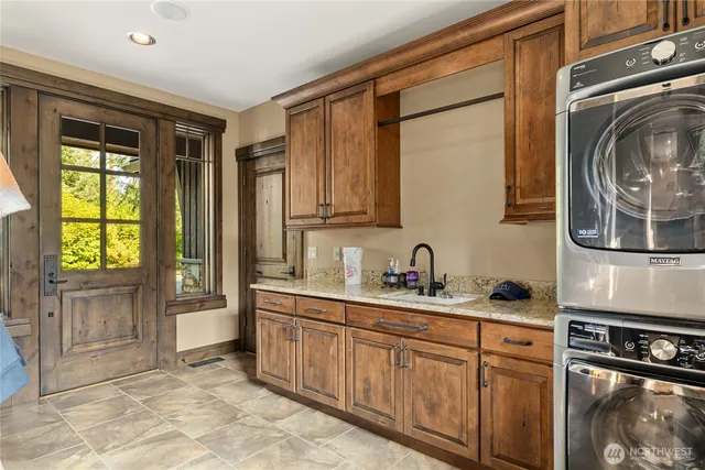 a view of an entryway with wooden floor and door