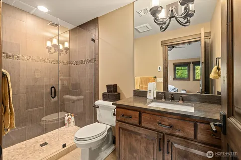 a living room with furniture a flat screen tv and a large window