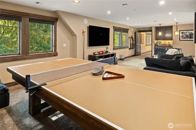 a bathroom with a double vanity sink toilet and a mirror