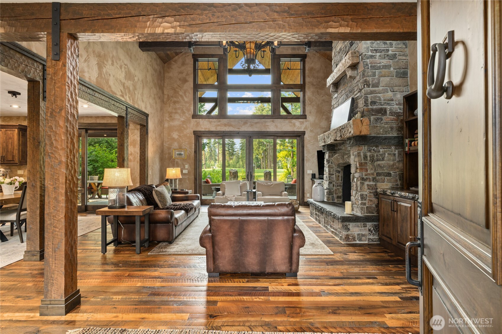 530 Spragger Way Cle Elum, WA 98922 - Photo 5 of 40 a living room with fireplace furniture and a floor to ceiling window