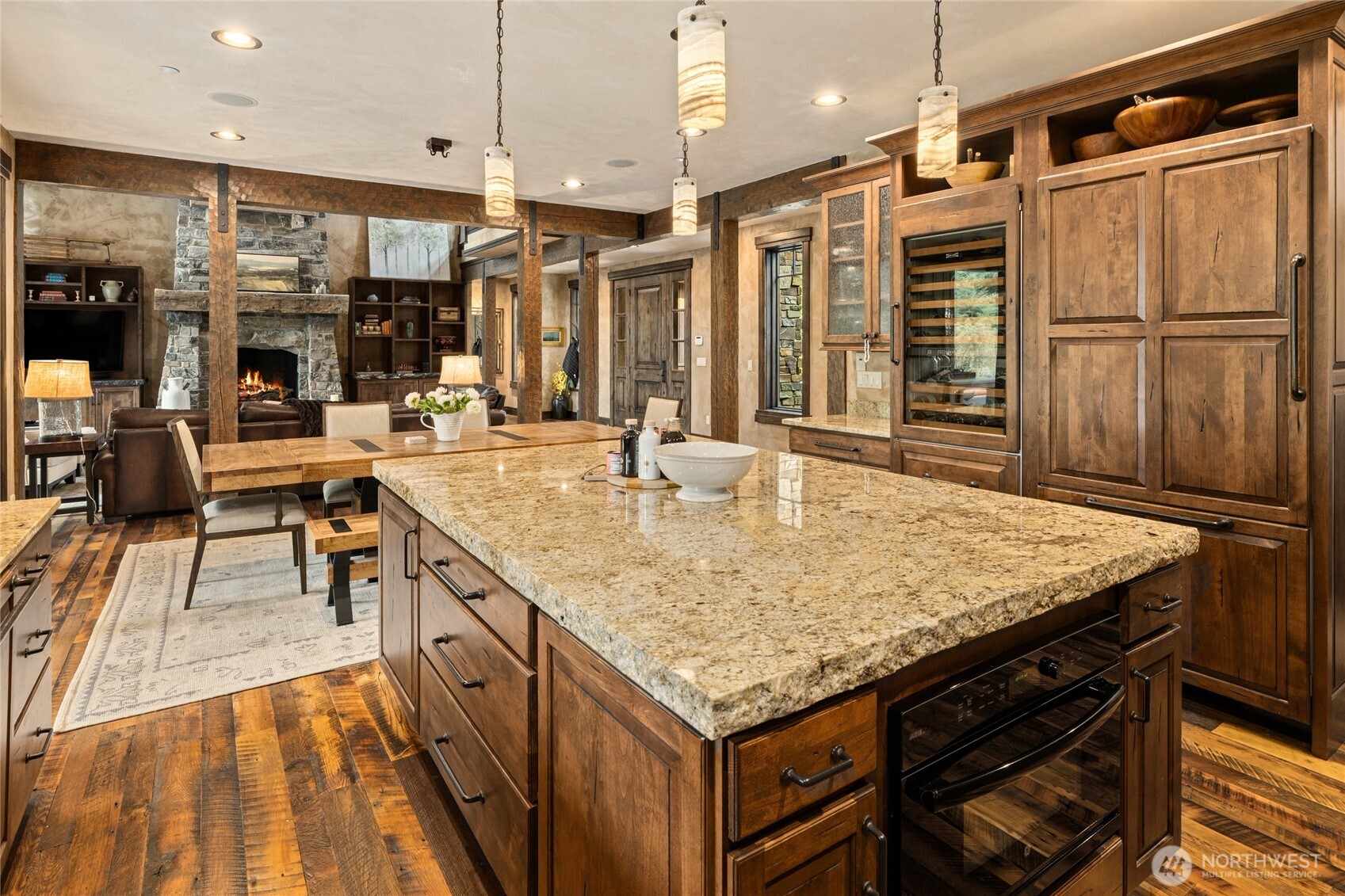 530 Spragger Way Cle Elum, WA 98922 - Photo 10 of 40 a kitchen with stainless steel appliances granite countertop a table chairs and a wooden floors