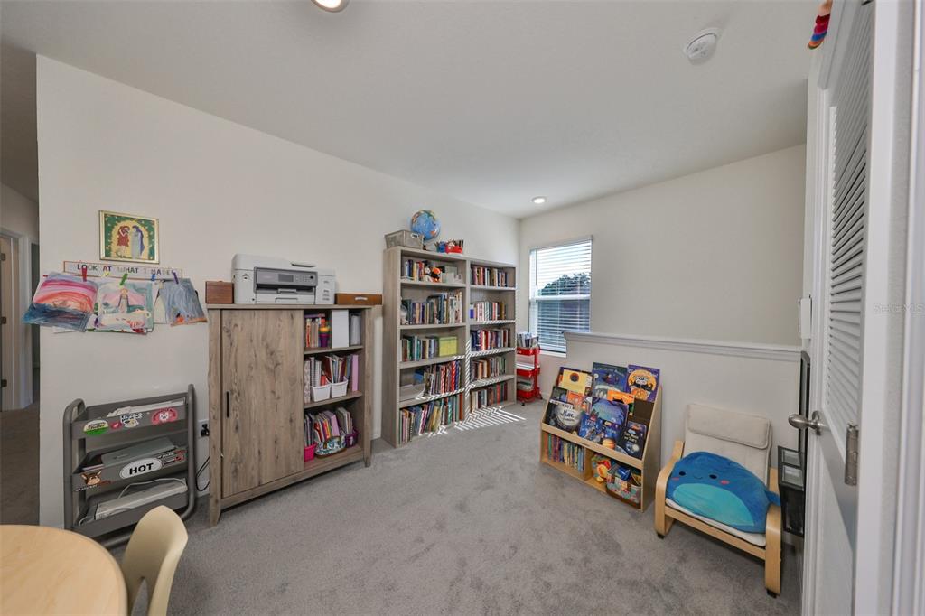 3528 Maple Grv Way Plant City, FL 33565 - Photo 21 of 51 a children room with furniture and a book shelf