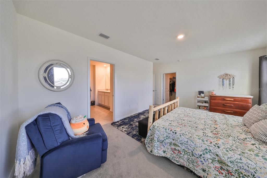 3528 Maple Grv Way Plant City, FL 33565 - Photo 24 of 51 a bedroom with bed couch and window