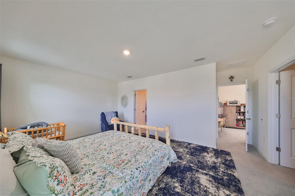 3528 Maple Grv Way Plant City, FL 33565 - Photo 25 of 51 a bedroom with a bed and a dresser