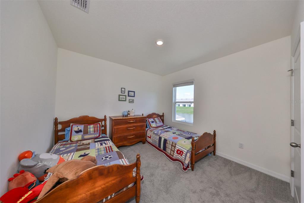 3528 Maple Grv Way Plant City, FL 33565 - Photo 28 of 51 a bedroom with furniture and a window