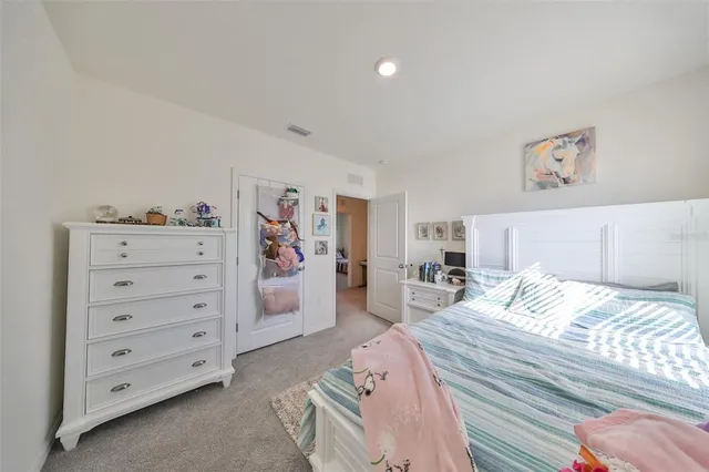 a bedroom with a bed and a tv